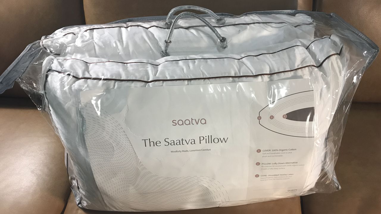 Saatva Latex Pillows in plastic packaging with a handle