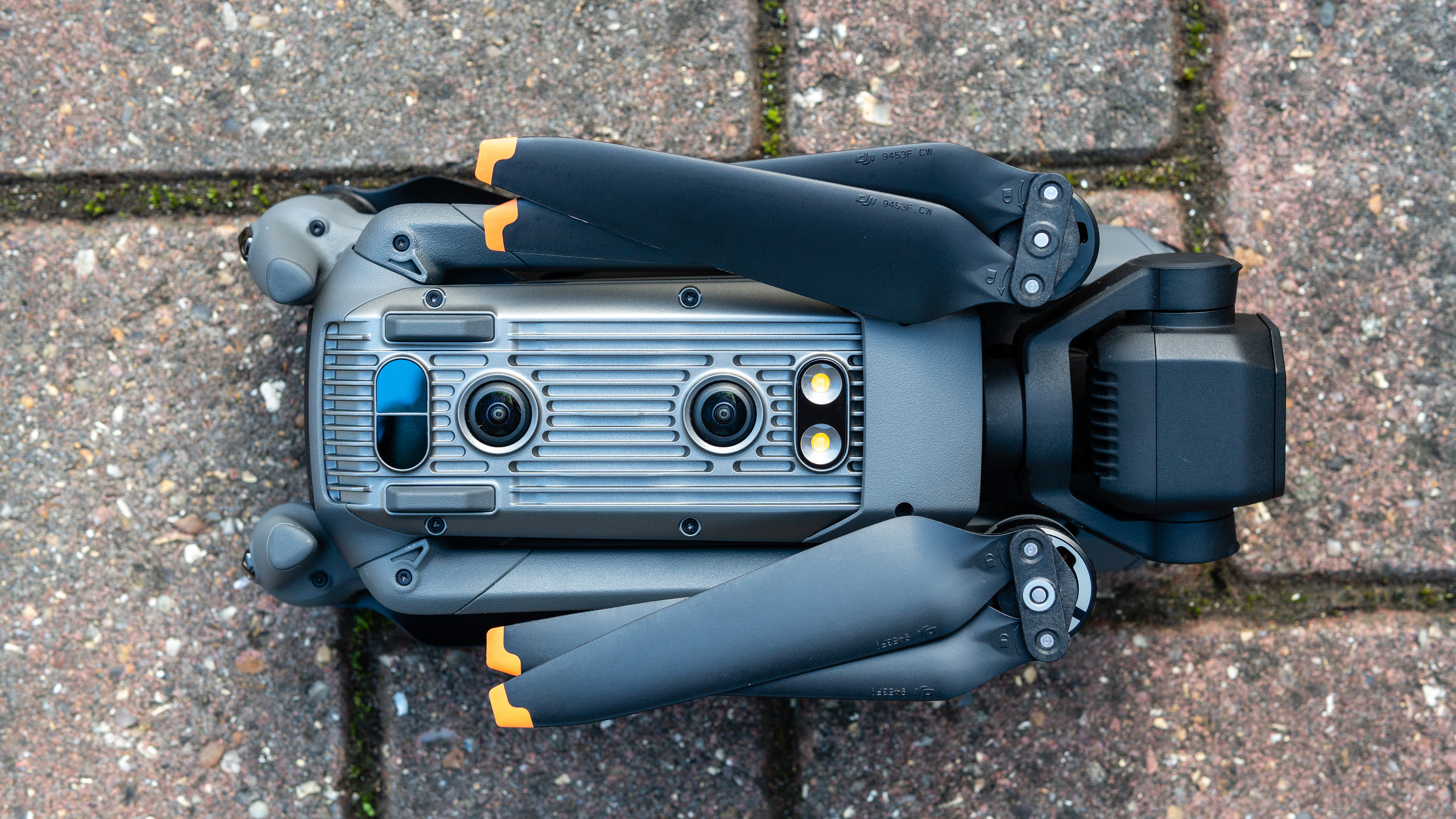 A folded DJI Mavic 3 drone resting on a patio