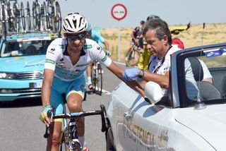 Fabio Aru gets some medical attention during Stage 19 of the 2015 Vuelta Espana