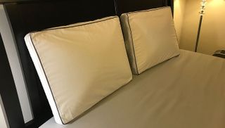 Two Nolah Cooling Foam Pillows side by side on a bed