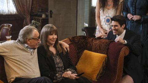 Chip Zein, Laraine Newman sit on a couch with Asher Grodman next to them in Ghosts