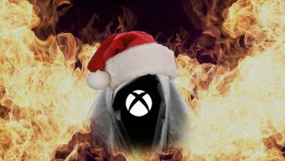 Xbox logo phantom wearing Christmas hat surrounded by fire