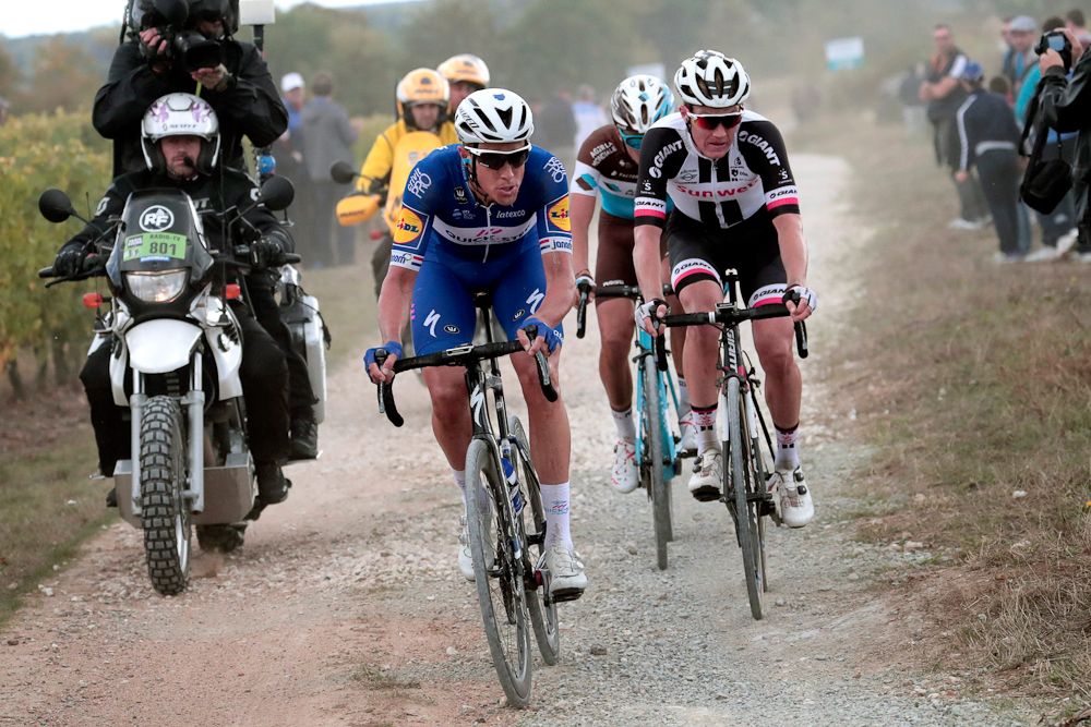 Niki Terpstra, Soren Kragh Andersen and Benoit Cosnefroy ride on the gravel at Paris-Tours