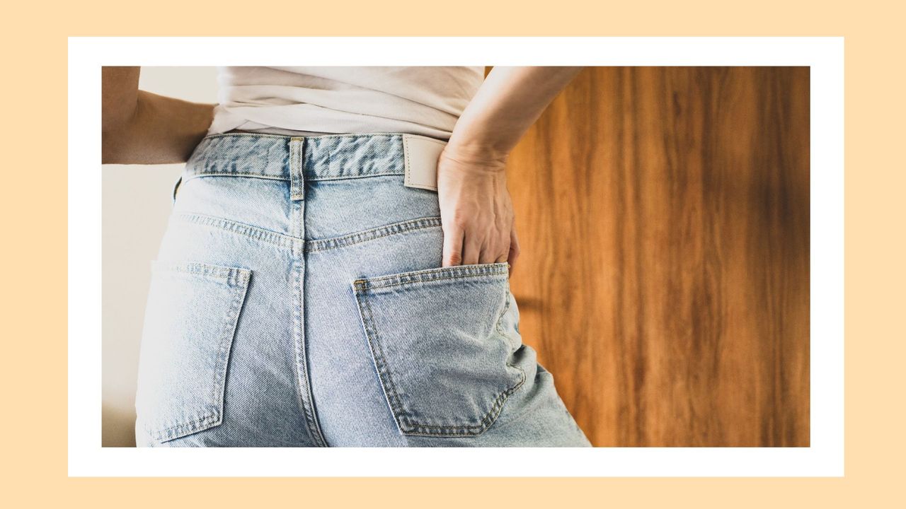 women seen from the back with jeans on, with a yellow border around the image