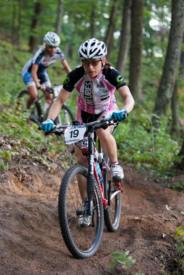 Nina Baum (Stan&rsquo;s NoTubes Elite Women) rides through tricky off camber switchbacks