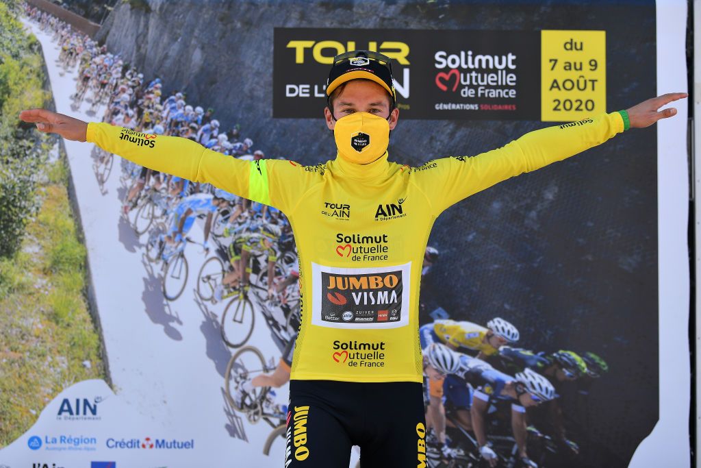 SAINTVULBAS FRANCE AUGUST 08 Podium Primoz Roglic of Slovenia and Team Jumbo Visma Yellow Leader Jersey Celebration Covid safety measures during the 32nd Tour de LAin 2020 Stage 2 a 141km stage from Lagnieu to Llex MontsJura 896m tourdelain TOURDELAIN TDA on August 08 2020 in SaintVulbas France Photo by Justin SetterfieldGetty Images