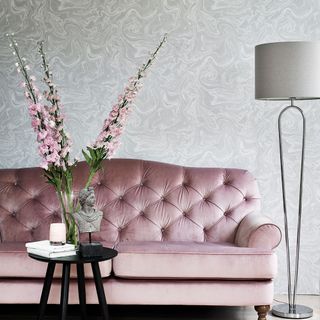 living room with pink sofa and black table