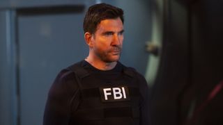 Dylan McDermott as Supervisory Special Agent Remy Scott in an FBI vest in FBI: Most Wanted season 4