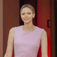 Princess Charlene wears a pink Barbiecore Oscar de la Renta dress and poses with daughter Princess Gabriella