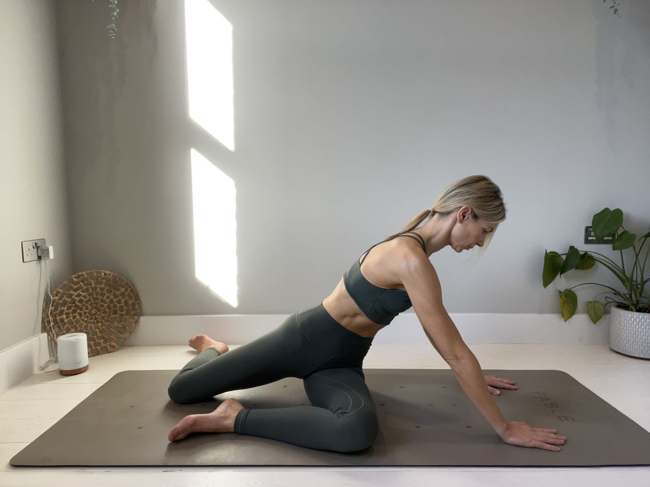 Pilates instructor Gemma Folkard demonstrating the mermaid stretch