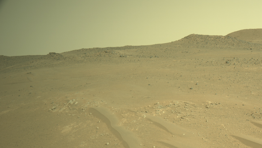 a terrain of red dirt under a reddish-orange sky