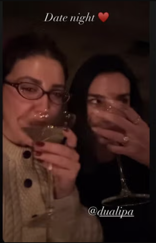 Dua Lipa and her close friend in a Jan. 8 instagram story flashing her engagement ring