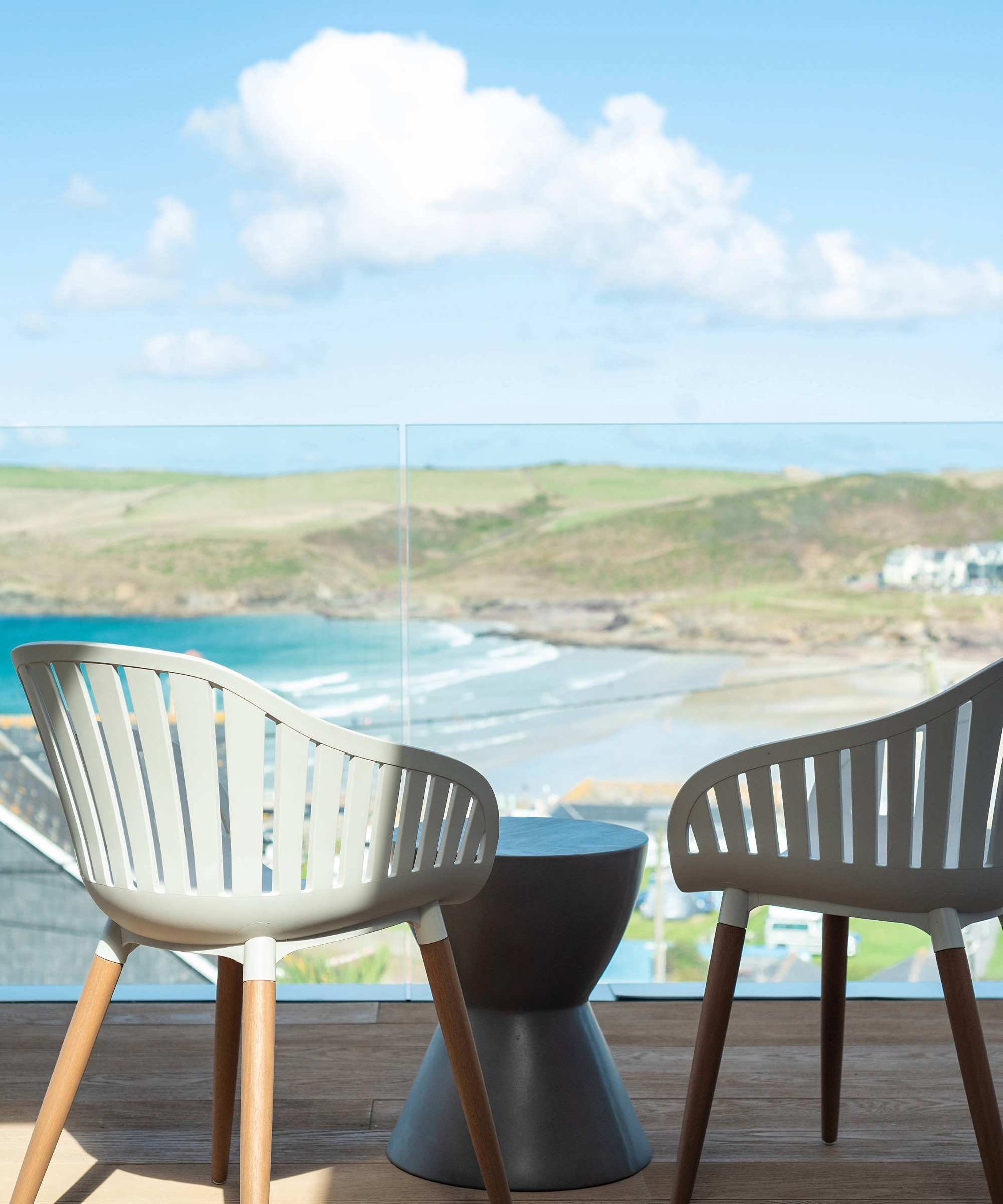 Chairs on the balcony overlooking sea views