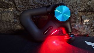 Theragun Pro Plus with the LED light turned on