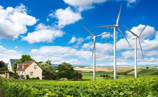 A domestic wind turbine has a generator that turns kinetic energy into electricity