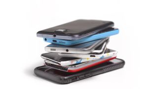 A stack of old smartphones