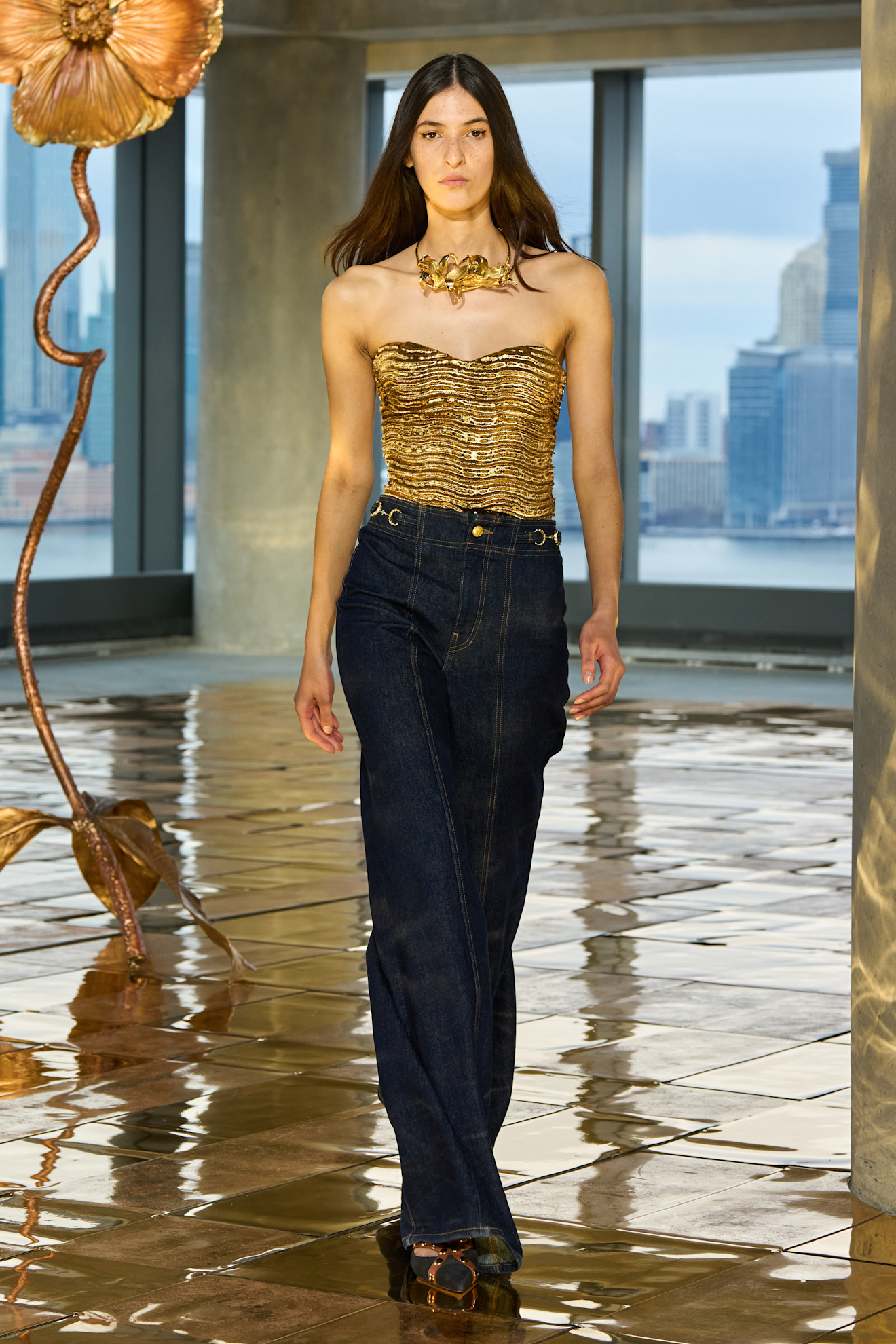 Woman in jeans with front seams.