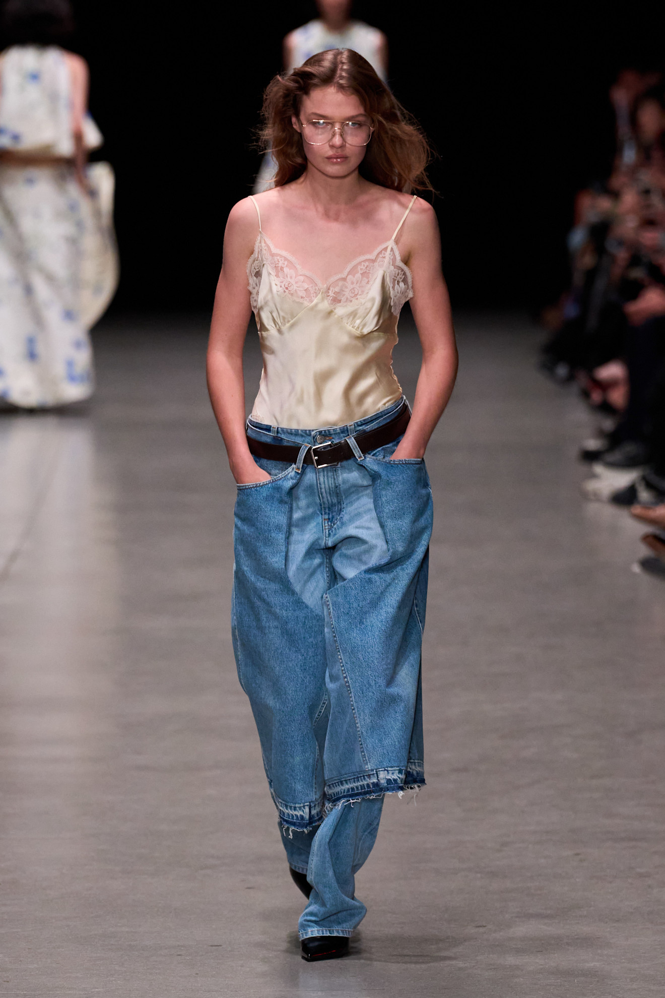 A model wore a denim skirt over jeans on the Stella McCartney Spring 2026 runway