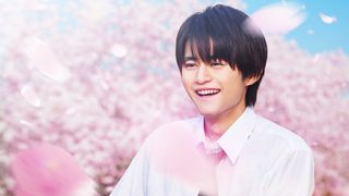 Shota Kazehaya with cherry blossom in the background