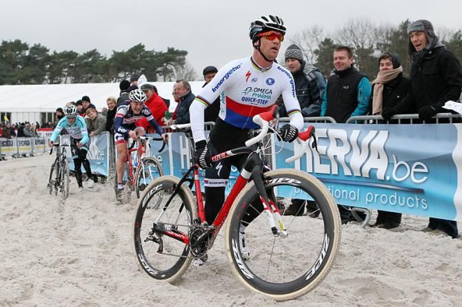 Zdenek Stybar runs through the sand.