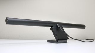 A monitor light bar with a USB-C cable plugged in at the rear
