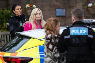 The women are taken away in a police car in Hollyoaks.