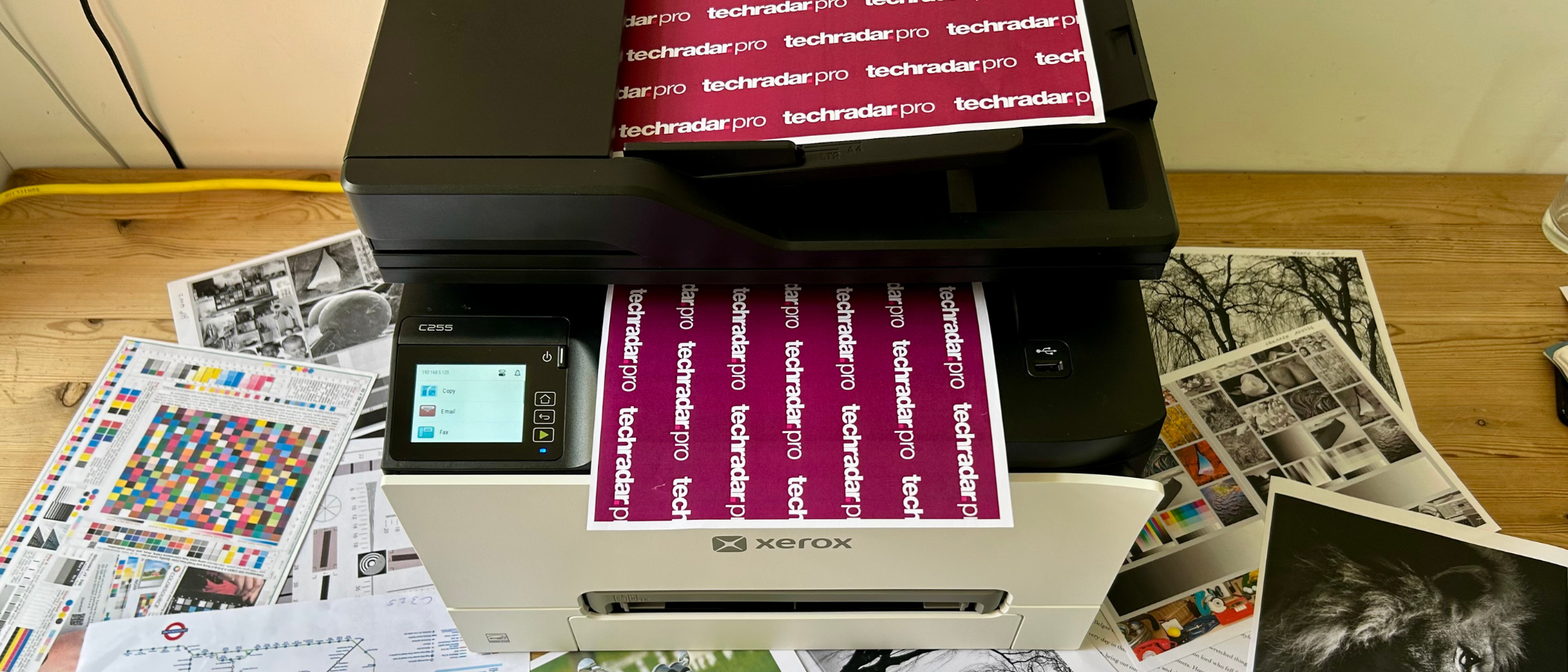 The Xerox C255a during our tests in a home office, showing a selection of printed materials in color