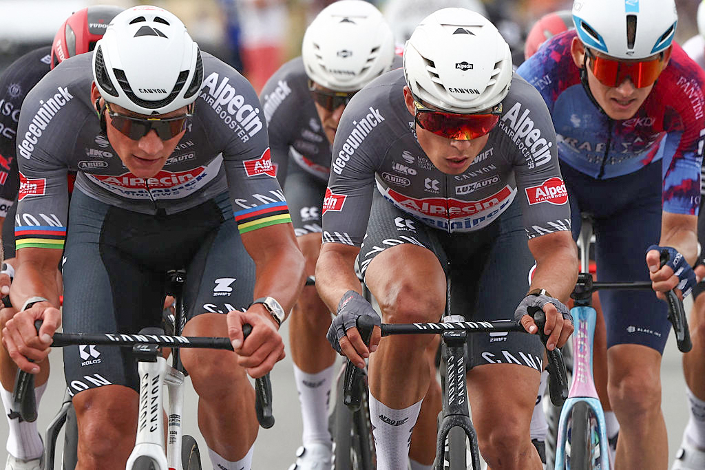 (From L) Alpecin - Deceuninck team's Dutch rider Mathieu van der Poel (L) and Alpecin - Deceuninck team's Belgian rider Jasper Philipsen (R) cycle with the pack of riders (peloton) during the 1st stage of the 112th edition of the Tour de France cycling race, 184.9 km starting and finishing in Lille Metropole, northern France, on July 5, 2025. (Photo by Anne-Christine POUJOULAT / AFP) (Photo by ANNE-CHRISTINE POUJOULAT/AFP via Getty Images)