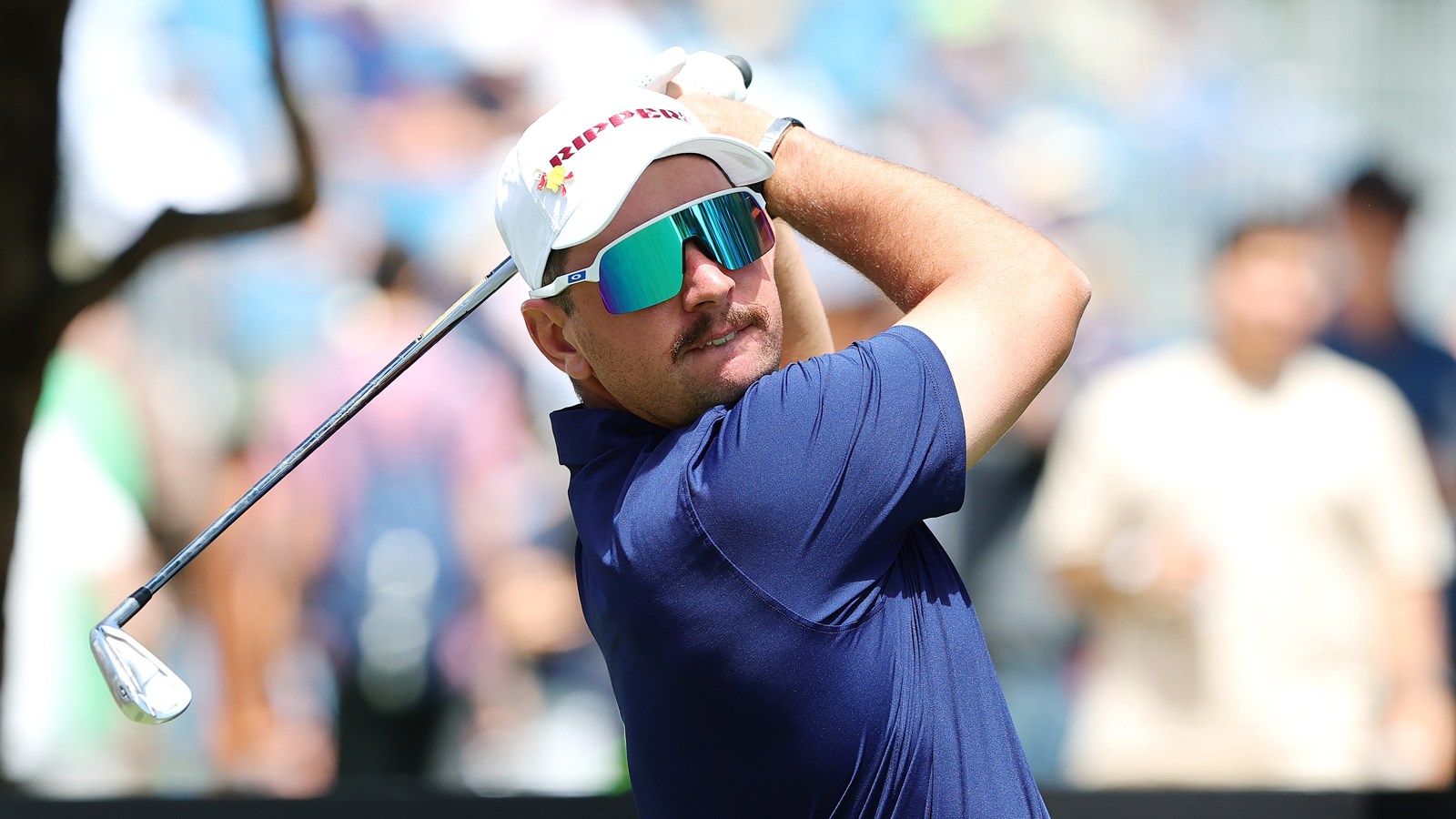 Lucas Herbert hits an iron shot