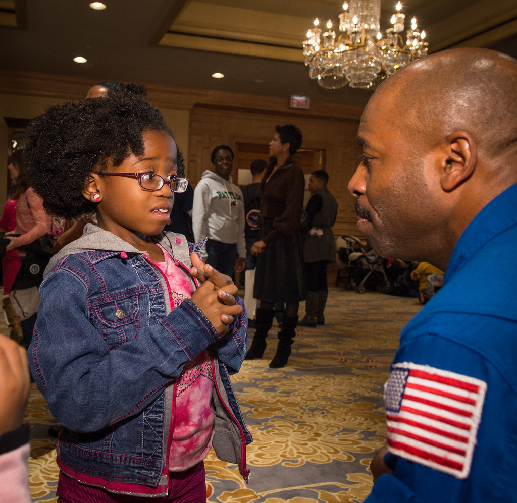 Astronaut Leland Melvin Talks to Young Girl at NASA Science Event