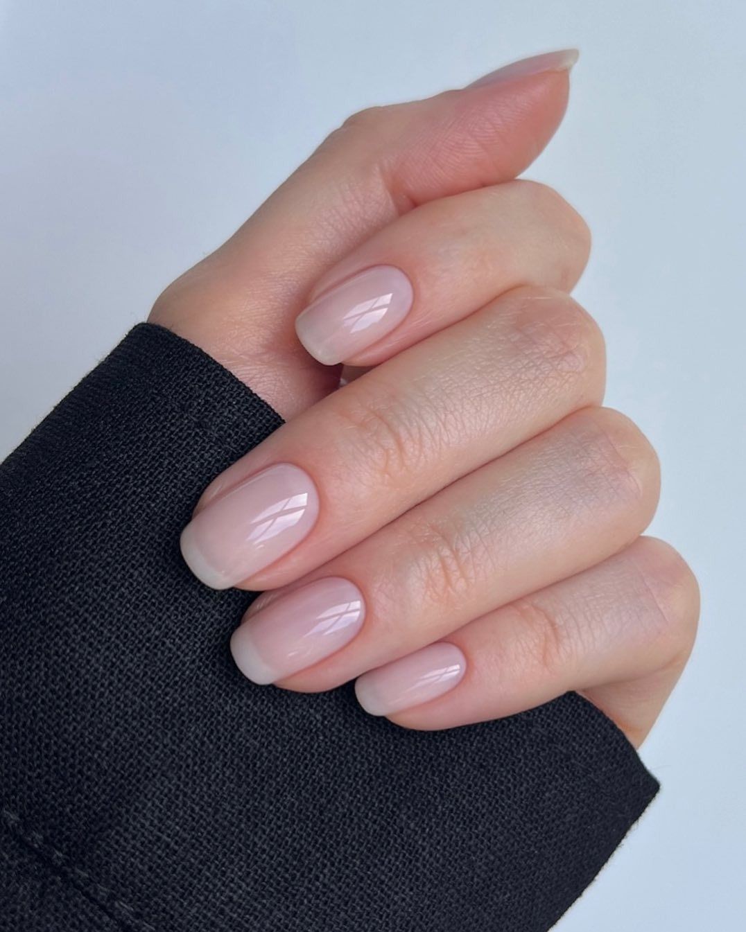 Long squoval nails with sheer neutral tulle colour