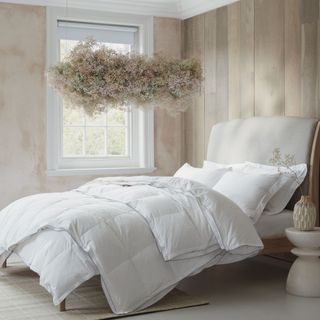 Double bed with white bedding in neutral bedroom