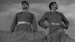 Two men stand on top of a cliff in The Little People in The Twilight Zone