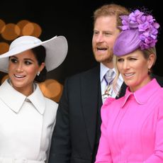 Meghan, Duchess of Sussex, Britain's Prince Harry, Duke of Sussex, and Zara Phillips leave after attending the National Service of Thanksgiving for The Queen's reign at Saint Paul's Cathedral in London on June 3, 2022 as part of Queen Elizabeth II's platinum jubilee celebrations. - Queen Elizabeth II kicked off the first of four days of celebrations marking her record-breaking 70 years on the throne, to cheering crowds of tens of thousands of people. But the 96-year-old sovereign's appearance at the Platinum Jubilee -- a milestone never previously reached by a British monarch -- took its toll, forcing her to pull out of a planned church service.