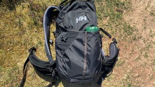 The FLSK drinking bottle in a backpack