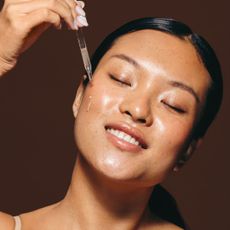 woman using one of the best face serums - getty images 1522079594