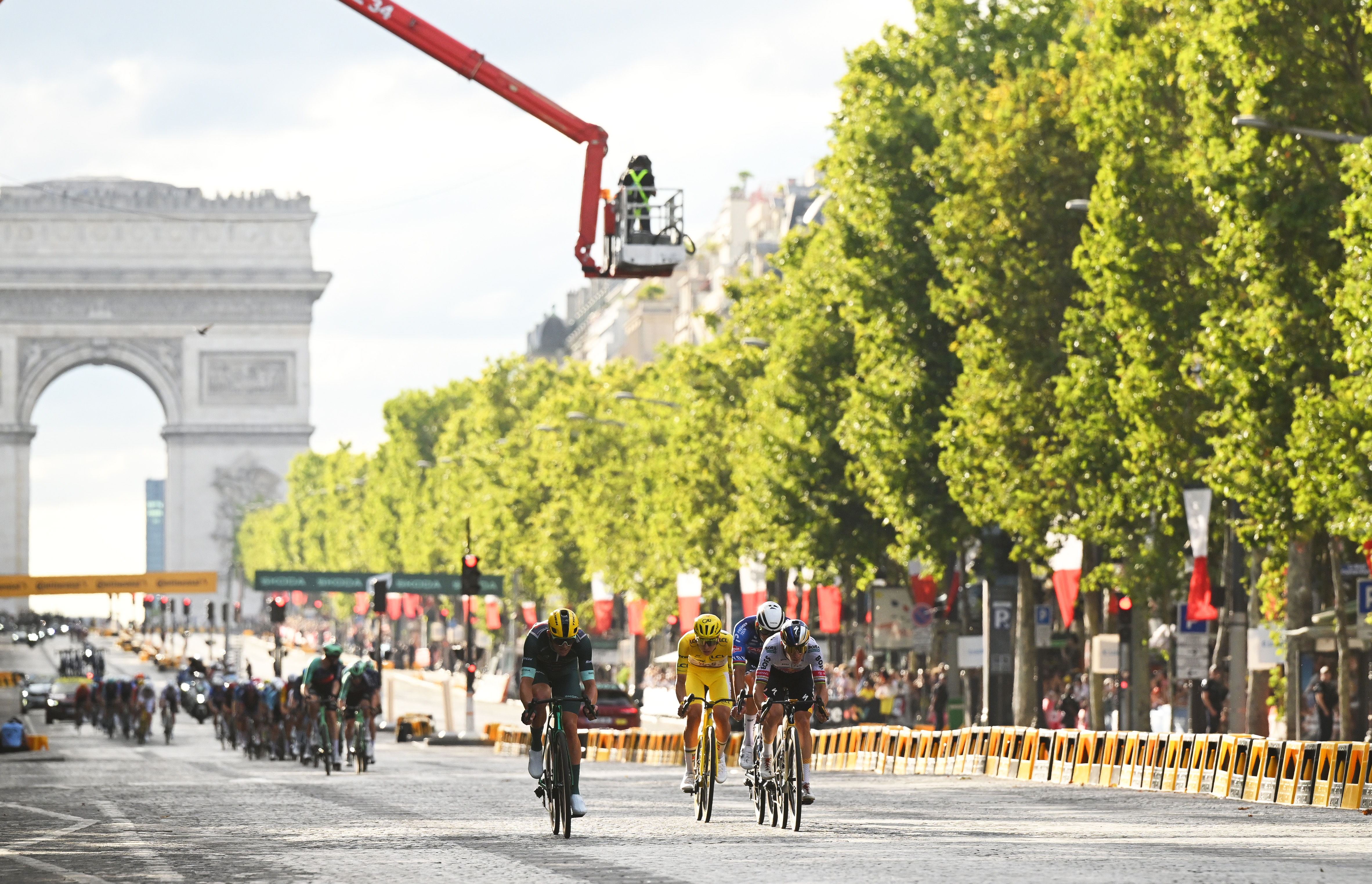 PARIS, FRANCE - JULY 26: A general view of Mads Pedersen of Denmark and Team Lidl - Trek - Green Sprint Jersey, Tadej Pogacar of Slovenia and UAE Team Emirates - XRG - Yellow Leader Jersey, Mathieu van der Poel of Netherlands and Team Alpecin-Premier Tech and Remco Evenepoel of Belgium and Team Red Bull - BORA - hansgrohe compete in the breakaway passing through a Champs-Elysees Avenue during the 113th Tour de France 2026, Stage 21 a 89km stage from Paris to Paris / #UCIWT / on July 26, 2026 in Paris, France. (Photo by Dario Belingheri/Getty Images)