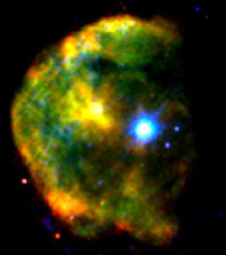 The magnetar 1E 2259+586 shines a brilliant blue-white in this false-color X-ray image of the CTB 109 supernova remnant, which lies about 10,000 light-years away toward the constellation Cassiopeia. X-rays at low, medium and high energies are respectively shown in red, green, and blue in this image created from observations acquired by the European Space Agency's XMM-Newton satellite in 2002.