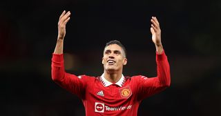 Manchester United defender Raphael Varane celebrates after their sides victory during the Premier League match between Manchester United and Tottenham Hotspur at Old Trafford on October 19, 2022 in Manchester, England