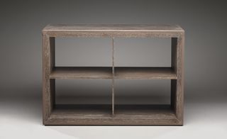 The 'Two Level Book Case' in oak is inset with flush strips of leather