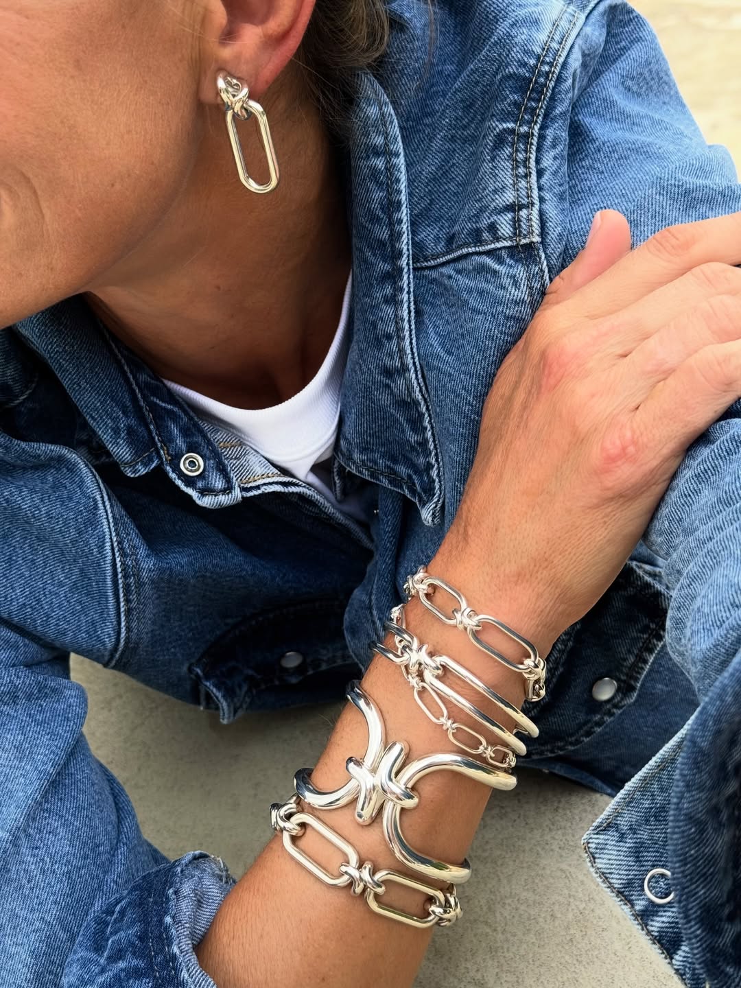 Annoushka Jewellery silver stacked bracelets and earrings