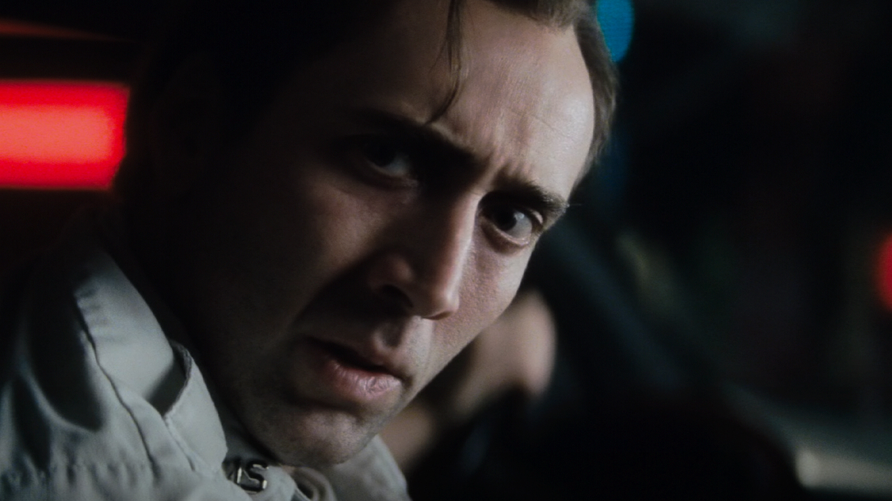 Close up of Nic Cage looking worn out in an EMT uniform, Bringing out the Dead.