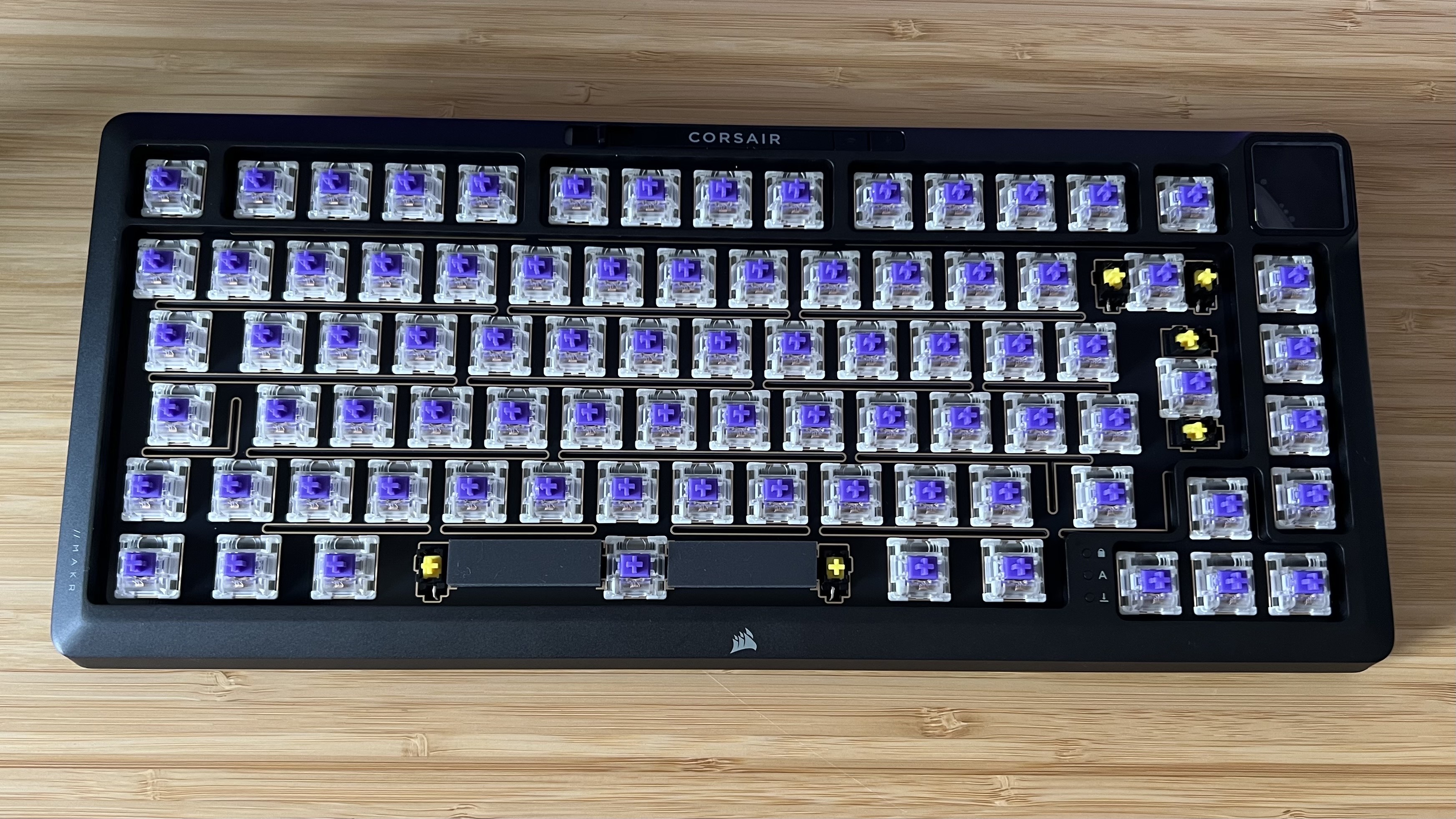 Corsair MAKR 75 keyboard with caps removed showing purple switches