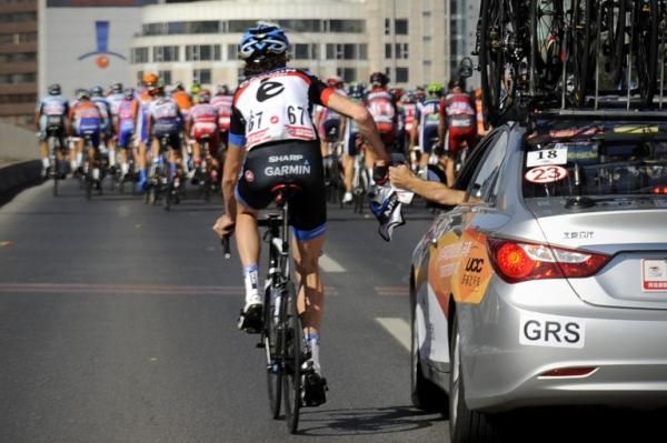 Johan Vansummeren (Garmin-Sharp) drops back to the team car for some assistance.