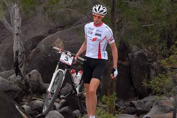Mike Mulkens walks his bike
