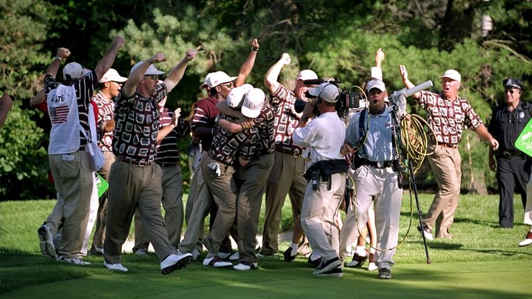 The US team celebrate on the green after Justin Leonard's putt on the 17th at the 1999 Ryder Cup