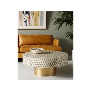 black and white coffee table with round gold base