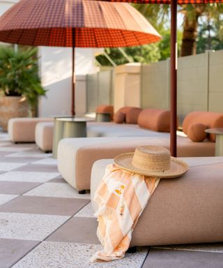 Cortney Bishop's patio design with outdoor sofa and parasols