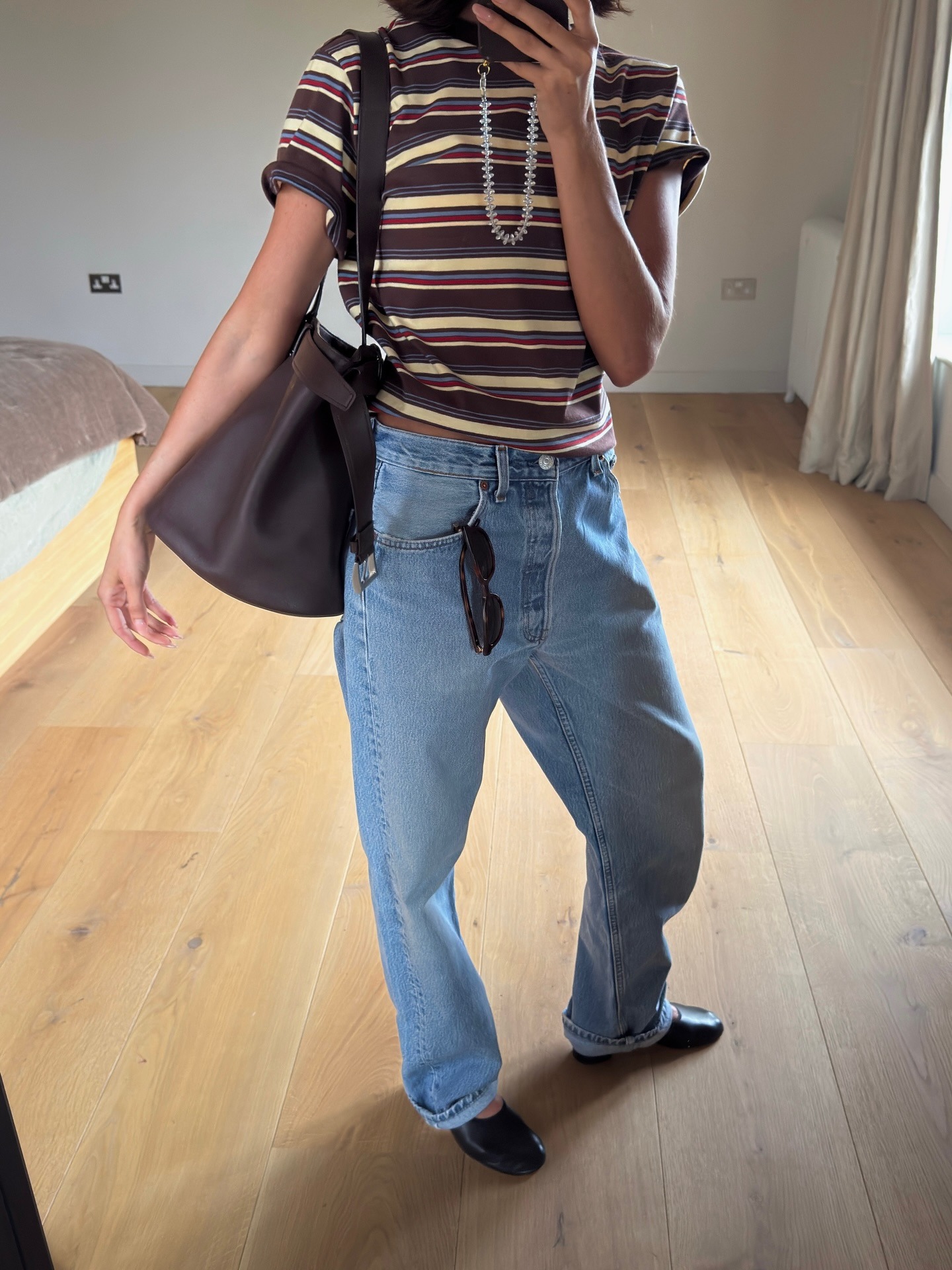 Woman in stripe tee and jeans