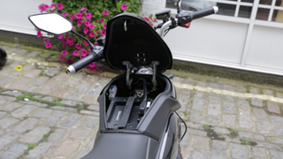 The bike's hefty battery can be accessed by opening the top of the bike's body